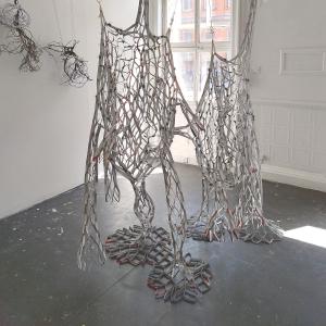 Reciprocal Space, beverage cartons, tape, gesso, 280 x 180 x 90 cm.