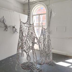 Reciprocal Space, beverage cartons, tape, gesso, 280 x 180 x 90 cm.