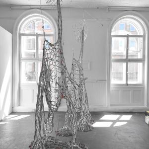 Reciprocal Space, beverage cartons, tape, gesso, 280 x 180 x 90 cm.